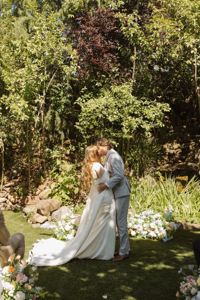 newlyweds kissing after their ceremony