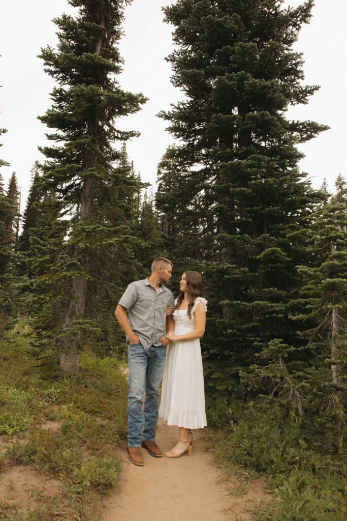 couple smiling at each other during their photoshoot