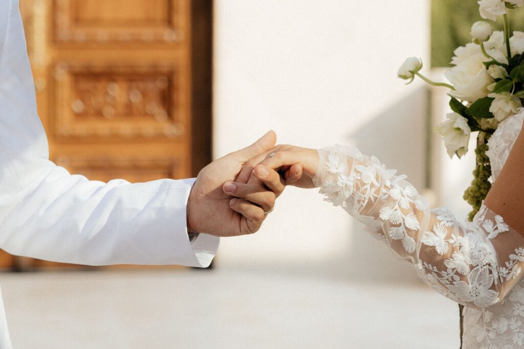 cute picture of the bride and groom holding hands