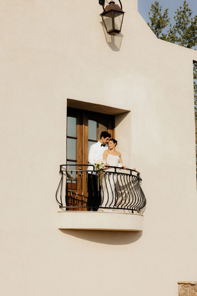 groom kissing the bride on the cheek