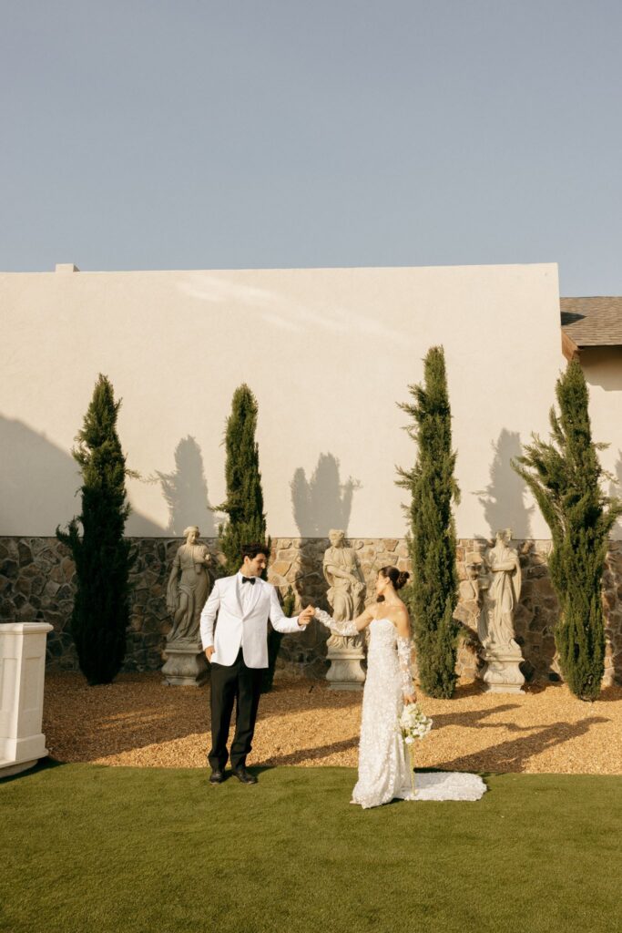 portrait of the newlyweds holding hands