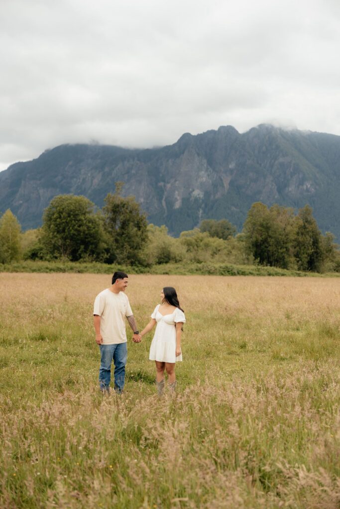 couple smiling at each other during their photoshoot