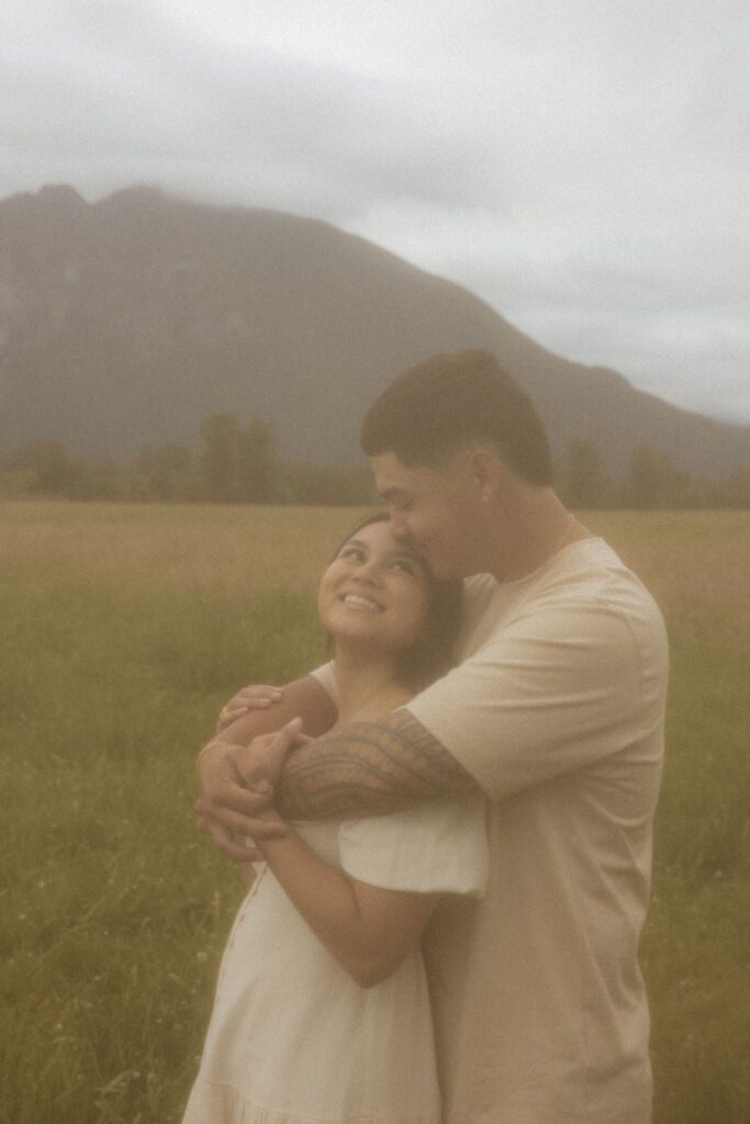 couple smiling at each other during their photoshoot