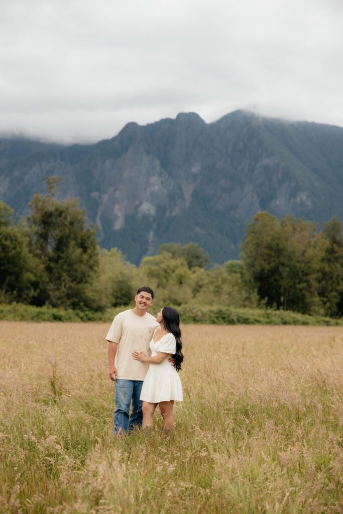 couple smiling at the camera during their photoshoot