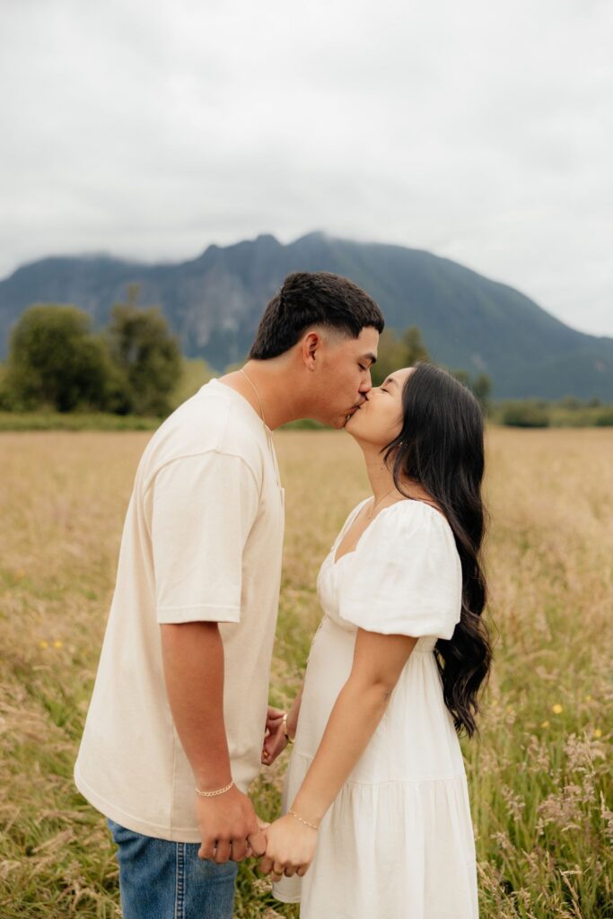 cute picture of the couple kissing during their moody portrait