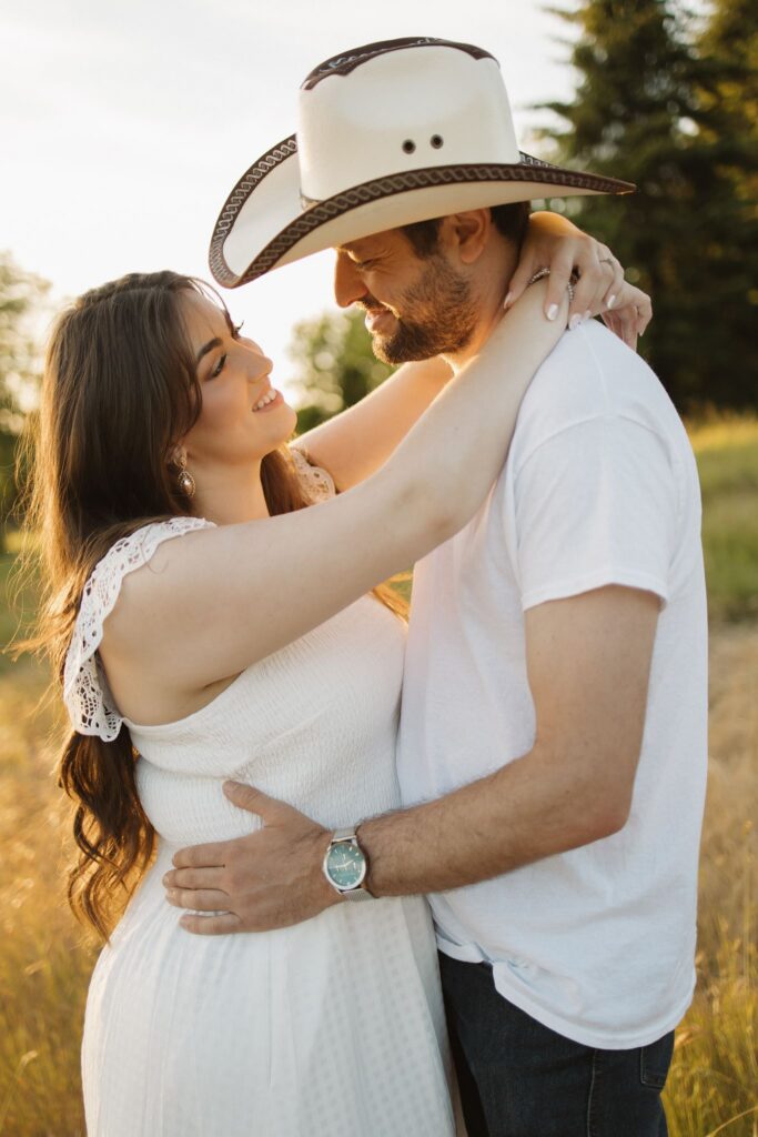 couple smiling at each other during their ceremony