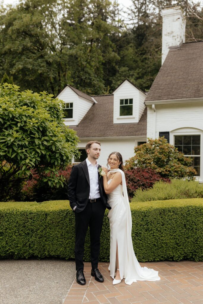 bride and groom posing for the camera during their photoshoot