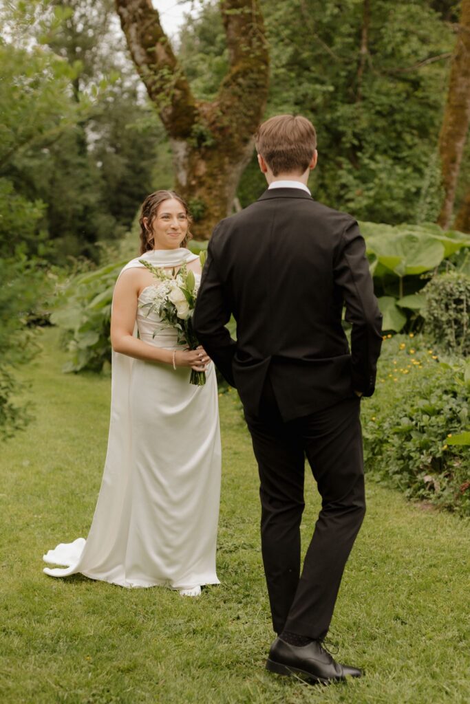 groom emotional seeing the bride in her wedding dress
