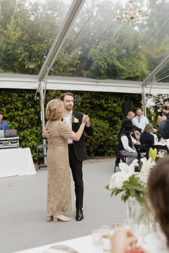 Cute picture of the groom and his mom dancing