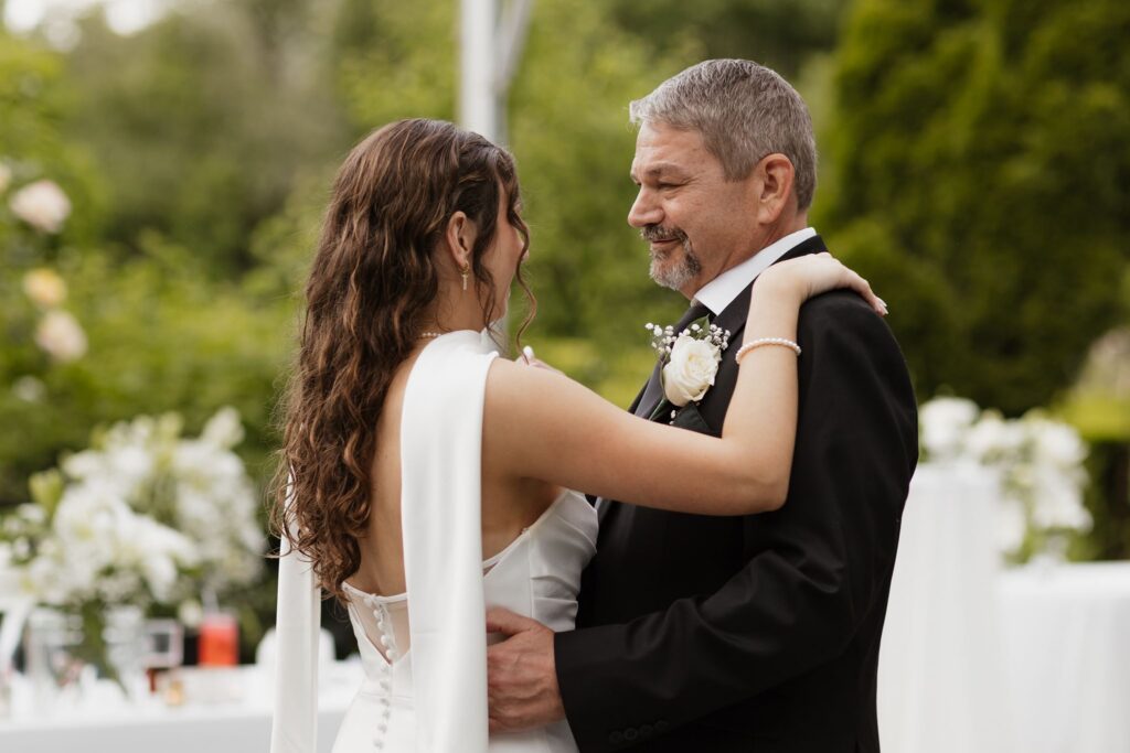 Portrait of the bride and her dad dancing