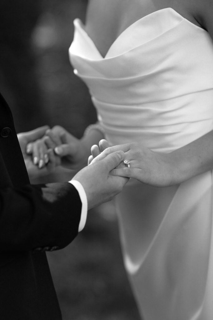 beautiful picture of the bride and groom holding hands