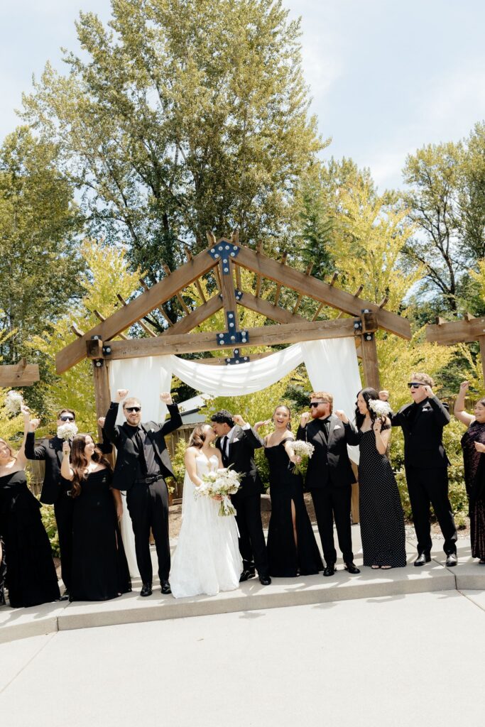 fun portrait of the newlyweds and their friends