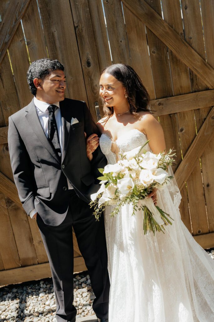 cute picture of the bride and groom smiling at each other