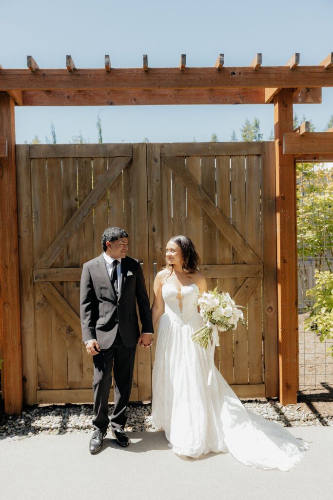 cute picture of the bride and groom holding hands