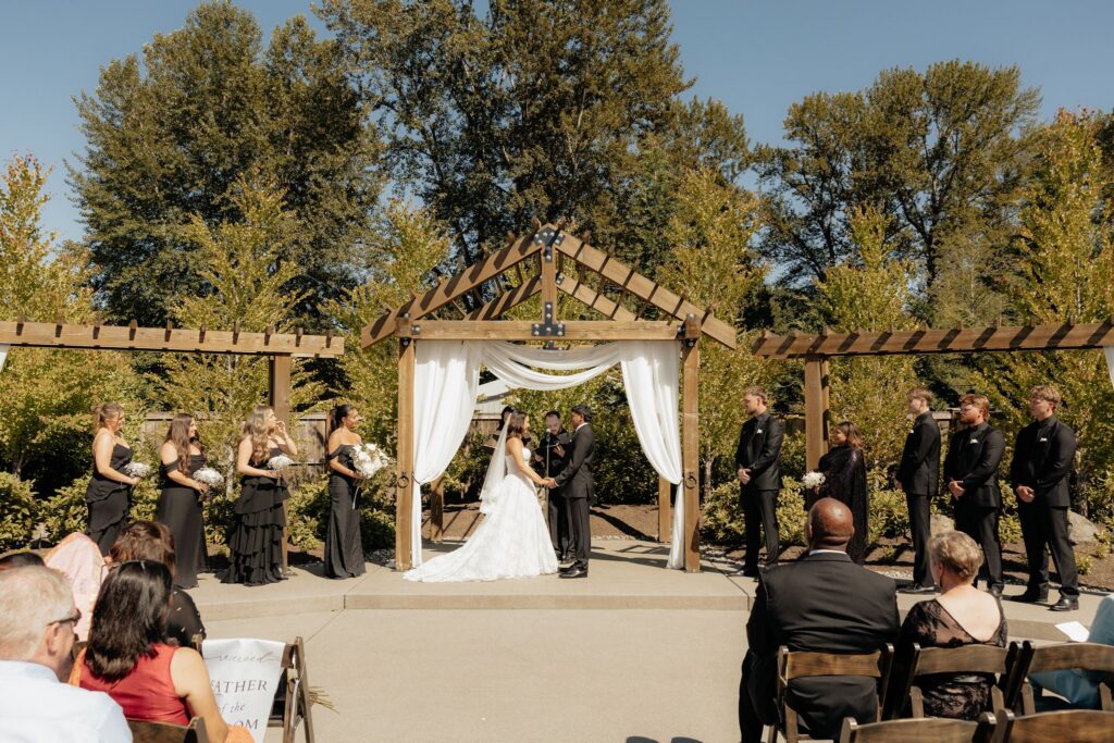 bride and groom holding hands during their ceremony