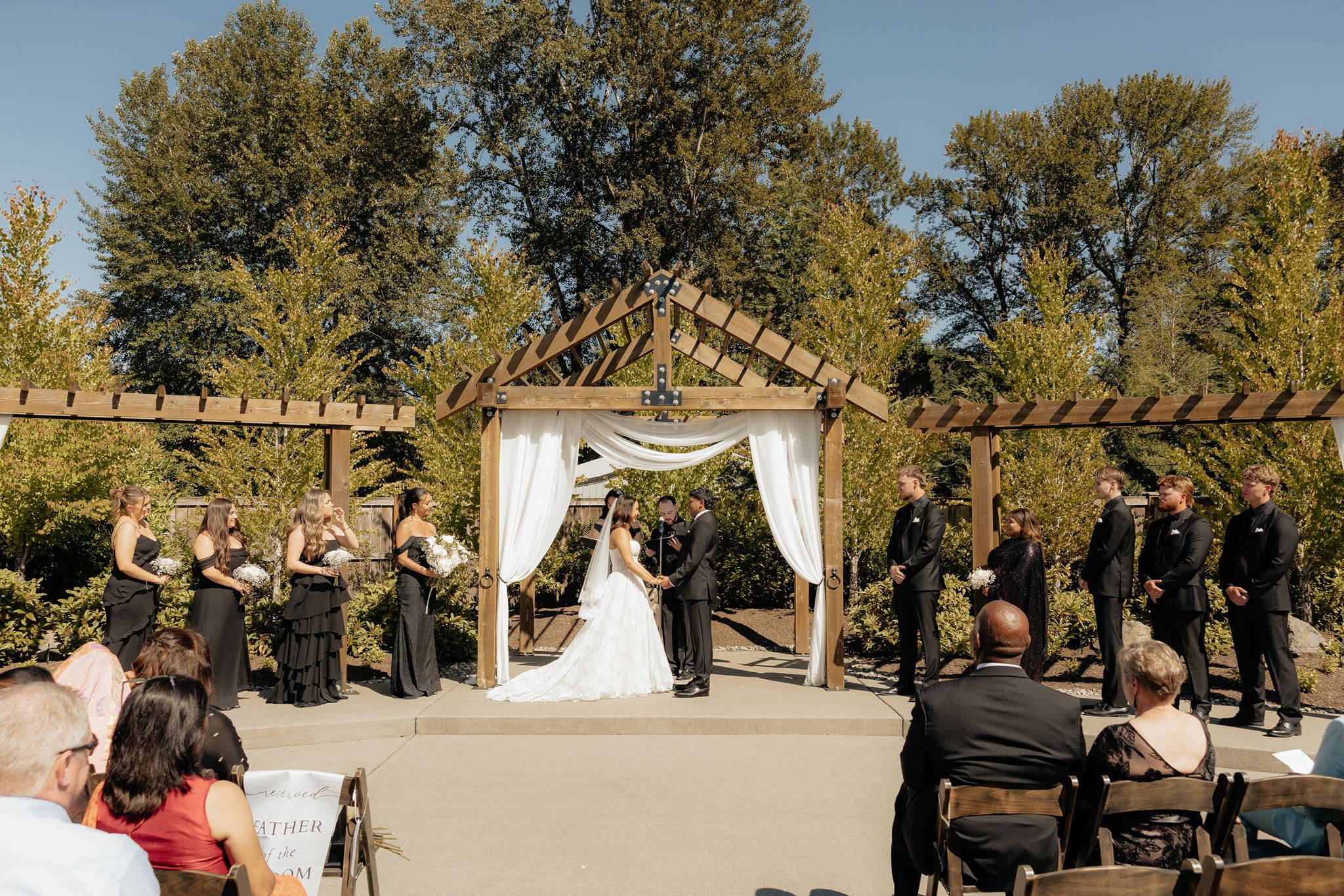 bride and groom holding hands during their ceremony