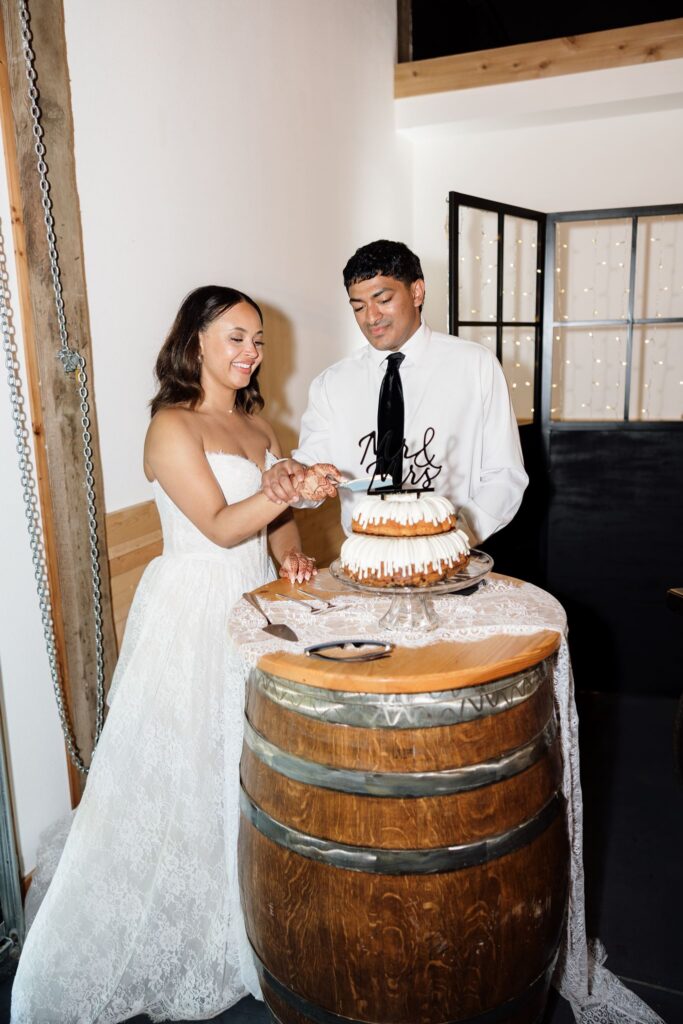 newlyweds cutting their wedding cake