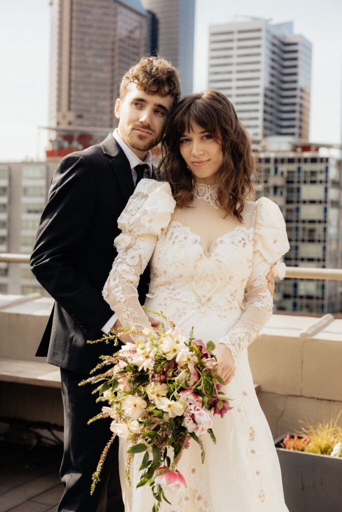 couple smiling at the camera during their phtooshoot