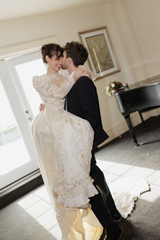 cute picture of the bride and groom kissing