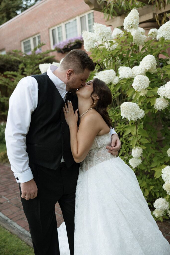 Portrait of the newly married couple kissing