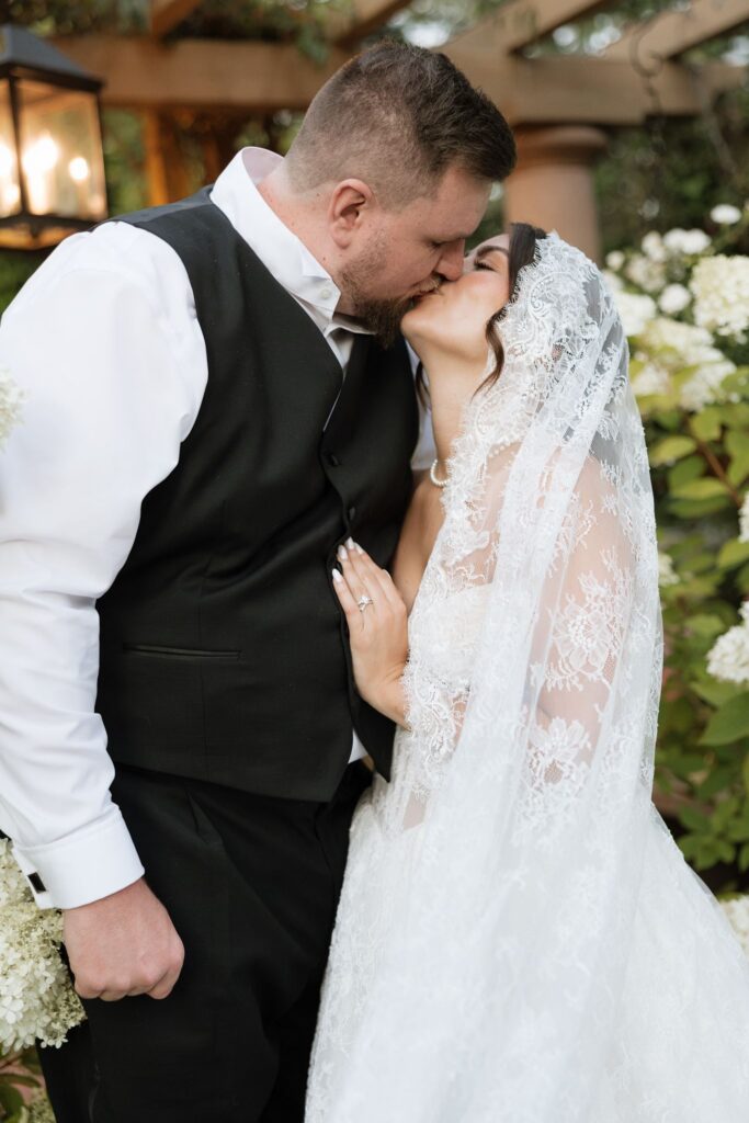 cute picture of the newlyweds kissing