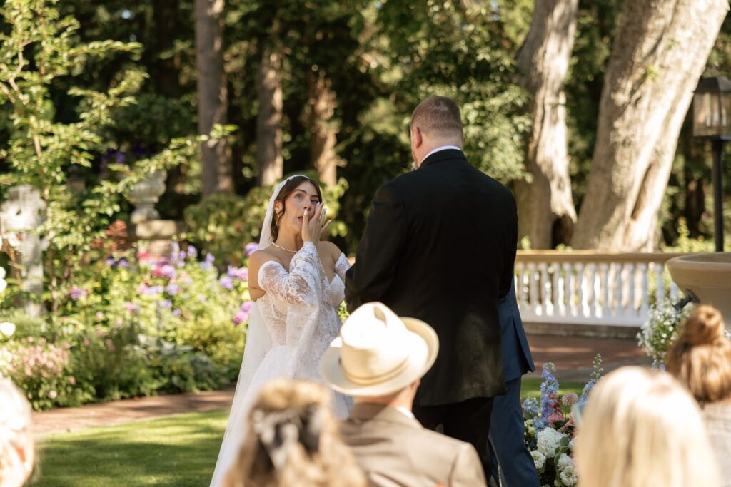 Bride and groom holding hands during their ceremony