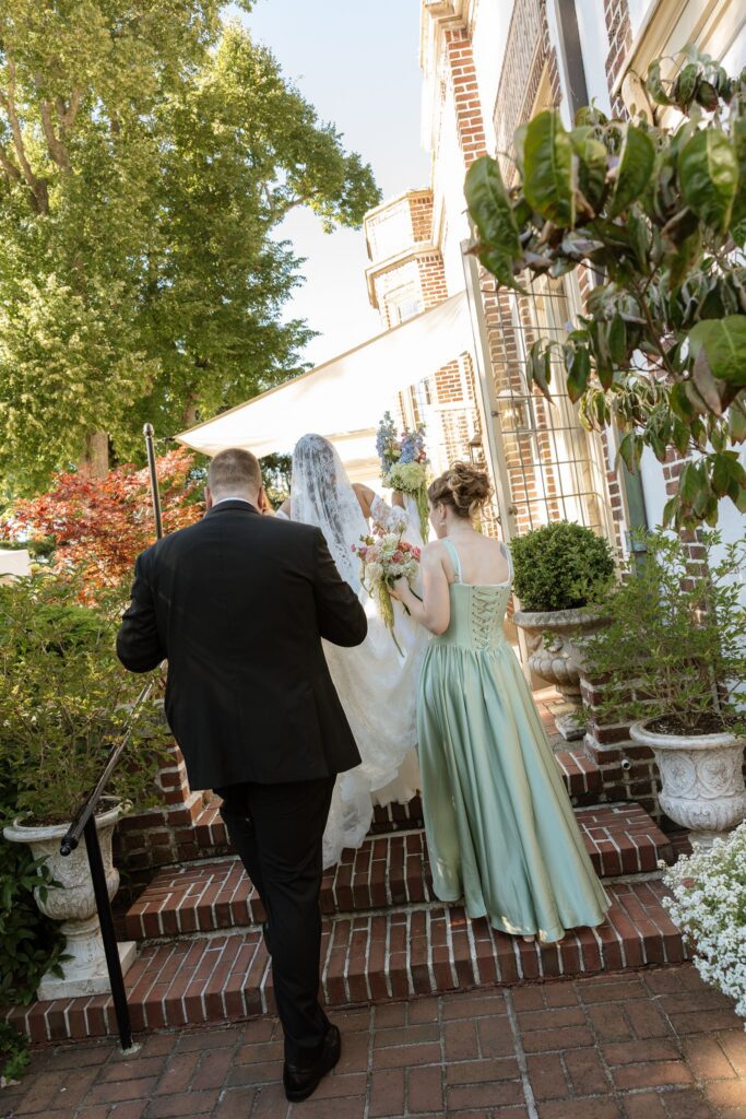 Newly married couple arriving at their cocktail hour