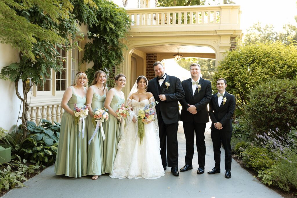 Portrait of the bride and groom with their friends