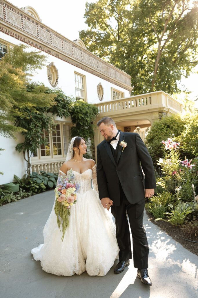 Picture of the bride and groom holding hands