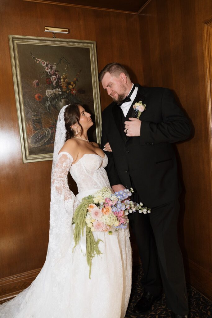 Picture of the newly married couple smiling at each other