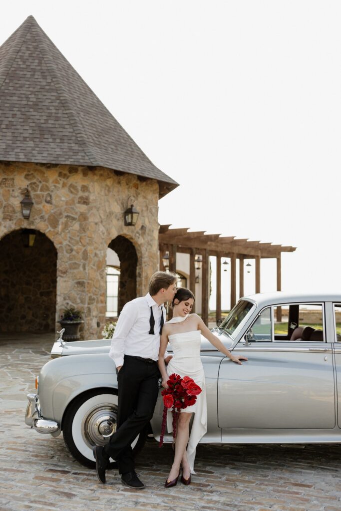 groom kissing the bride on the cheek