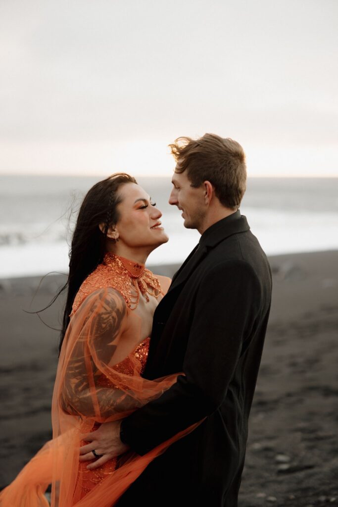 portrait of the bride and groom laughing with each other