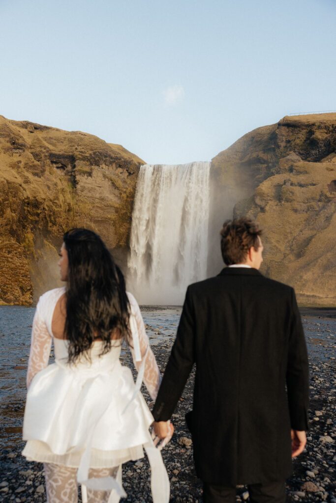 cute picture of the bride and groom holding hands