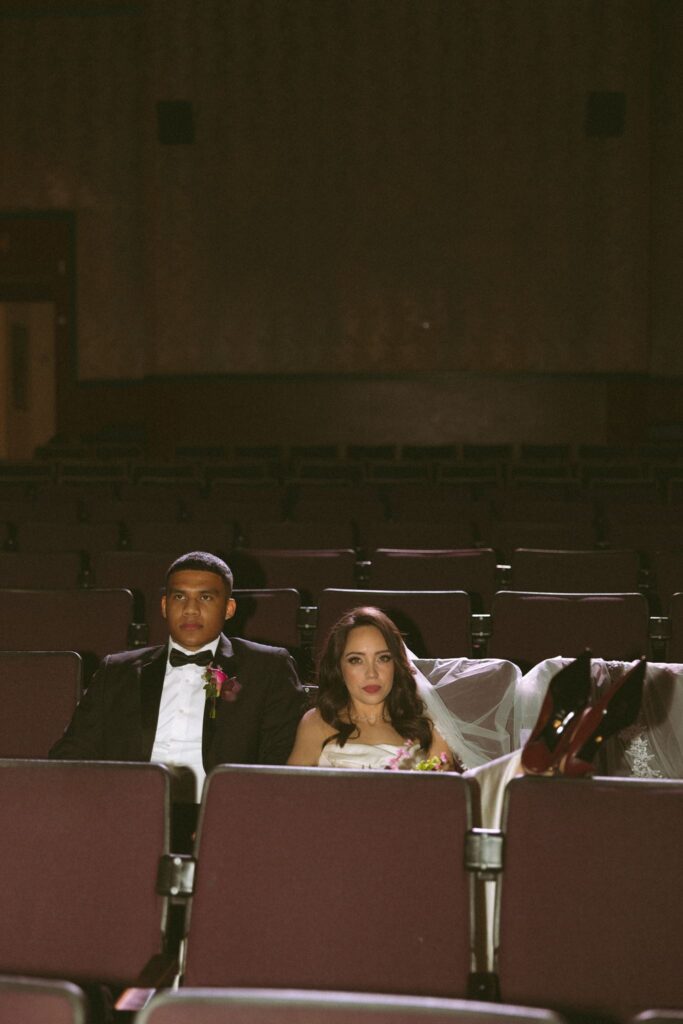 bride and groom smiling at the camera during their photoshoot