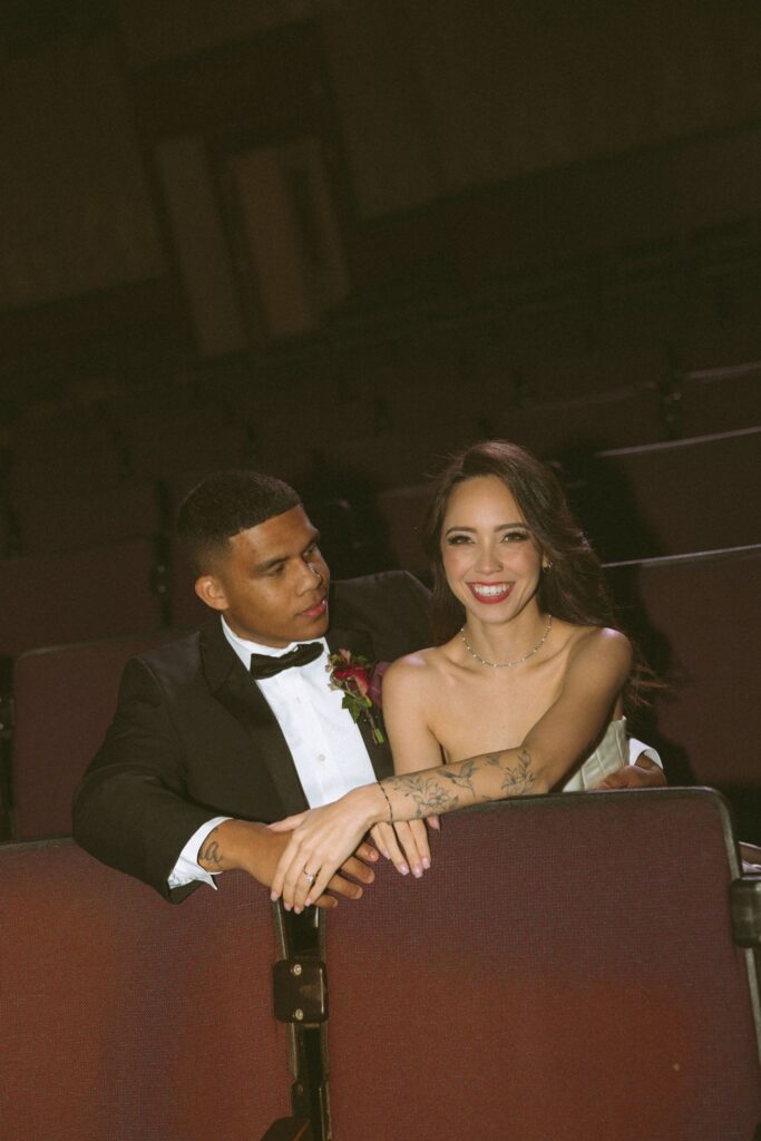 bride and groom laughing with each other during their photoshoot