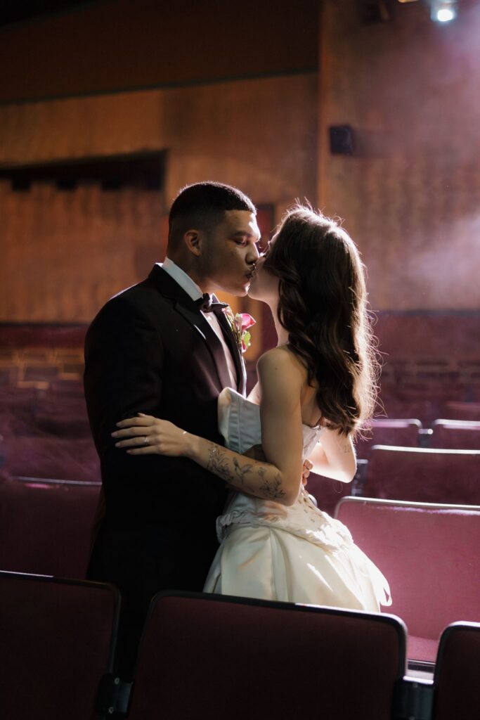 cute portrait of the bride and groom kissing