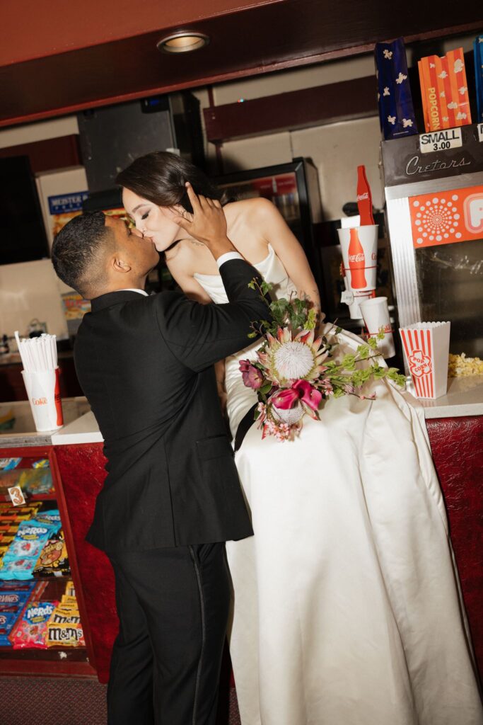 bride and groom, kissing during the romantic bridal session