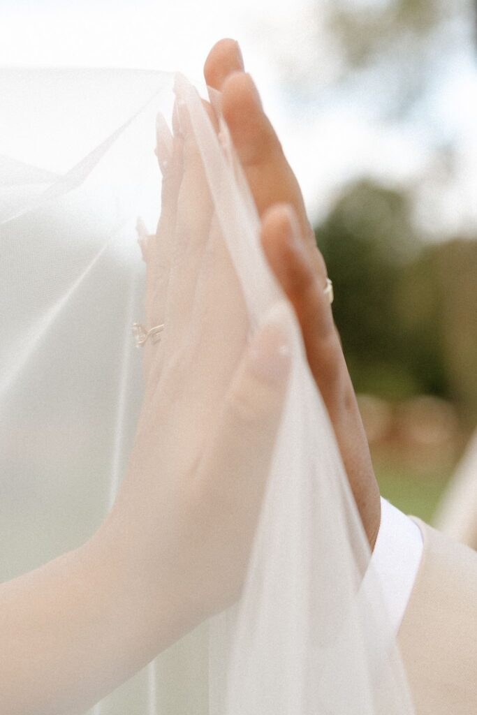 cute picture of the bride and groom holding hands