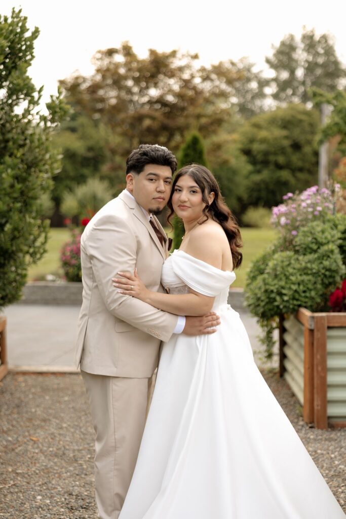 couple smiling at the camera during their photoshoot