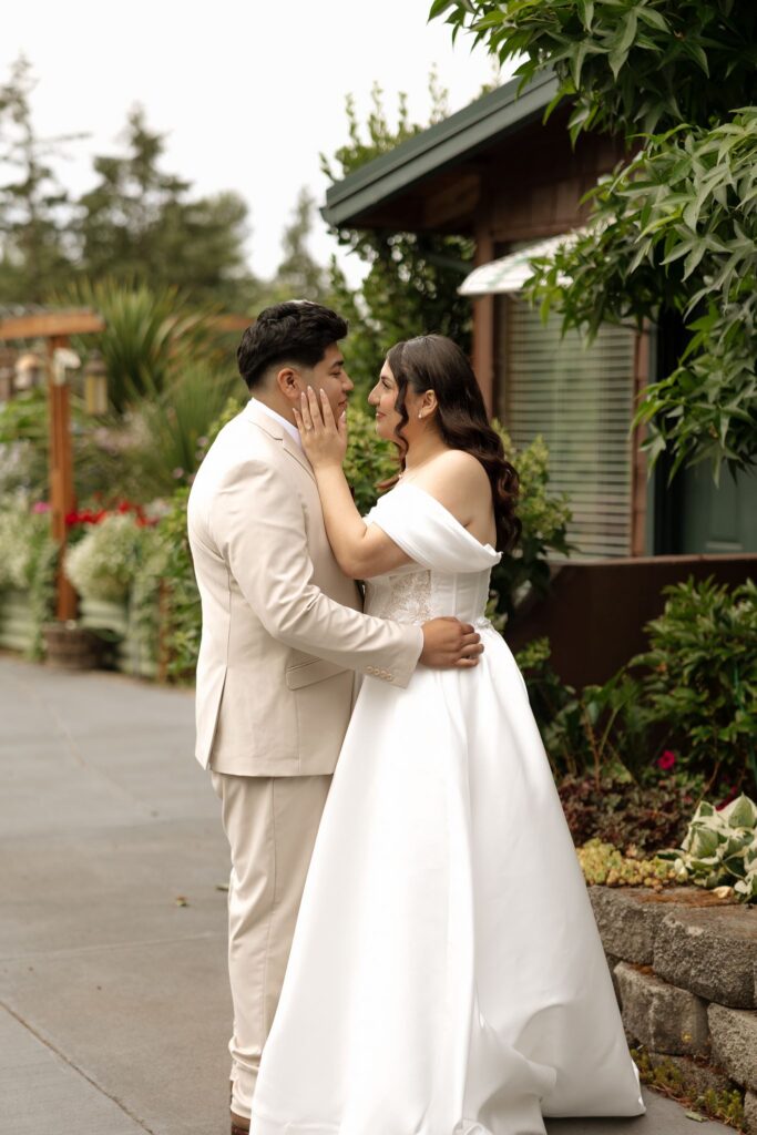cute portrait of the bride and groom kissing