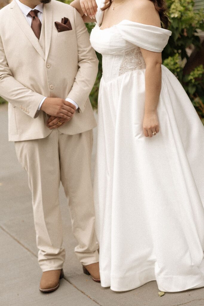 picture of the bride and groom holding hands