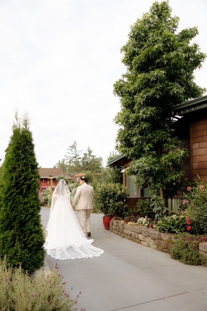 cute picture of the bride and groom holding hands