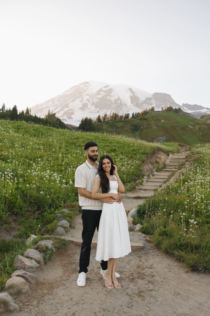 newly engaged couple hugging during their photoshoot