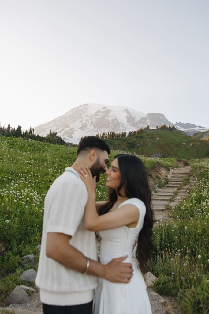 cute picture of the newly engaged couple kissing